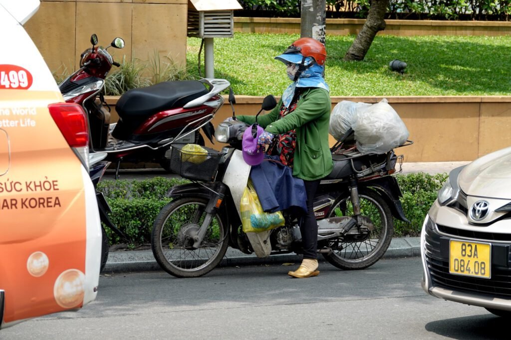 Vor allem im Süden Vietnams schützen sich die Menschen vor der Sonne.